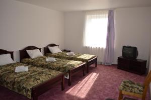 Postel nebo postele na pokoji v ubytování Hotel Tukums