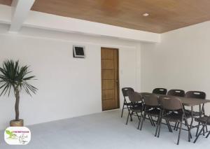 a conference room with a table and chairs at Newly Built Private Villa with Pool in Cainta in Cainta +20 photos