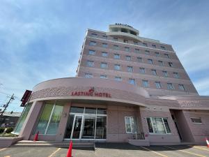 a building with a krispy kreme hotel at Lasting Hotel in Kushiro