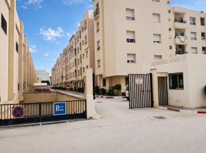 a gate in front of a building at Cozy Stay appartement in Sukrah