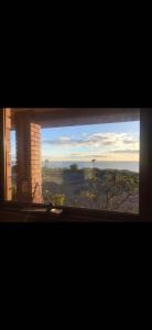 a window with a view of a city at The Bass Horizon - 5 bedrooms - 10 people - Bass Strait View in Devonport +12 photos