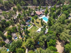 an aerial view of a house with a pool and trees at Gizli Cennet Villages Hotel in Fethiye