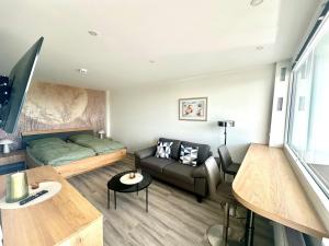 a living room with a couch and a table at Wolkenparadies in Altenau