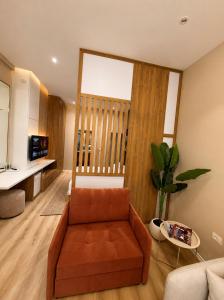a living room with a couch and a table at Le Onde Studio in Durrës +10 photos
