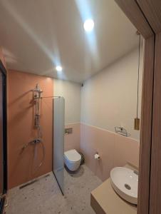 a bathroom with a shower and a toilet and a sink at Lina Life in Fethiye +80 photos