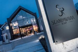 a building with a sign for a sennaium institution at SCANDINAVIA Resort in Zator +129 photos