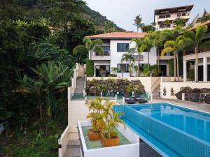 an aerial view of a villa with a swimming pool at Baan Chom View Residences in Kamala Beach