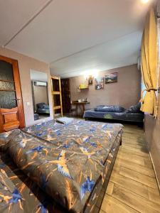 a bedroom with a bed with birds on it at Serce Kanyonu in Kamianets-Podilskyi