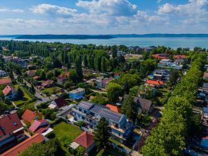 an aerial view of a town with a lake at AH-Premium Rooftop Apartman in Zamárdi