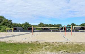a basketball court with a volley ball hoop at Beautiful Home In Skjern in Skjern +6 photos