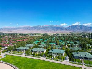 an aerial view of a resort with mountains in the background at Карвен коттедж in Bulan Sogottuu