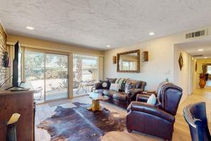 a living room with a couch and a table at Tranquil Trail #8 in Carefree