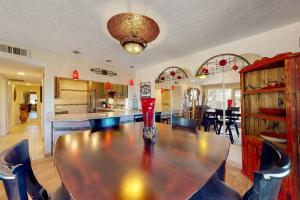 a dining room with a large wooden table and chairs at Tranquil Trail #8 in Carefree +12 photos