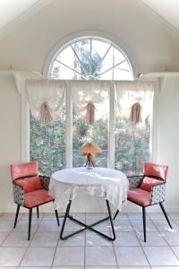 a dining room with a table and two chairs at Elegant Suite King Bed, Queen Sofa, Fast WiFi in Fayetteville
