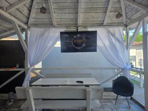 a tent with a table and a chair in a room at Holiday Village in Eforie Nord
