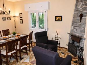 a living room with a table and a fireplace at Sogno dOro in Germignaga
