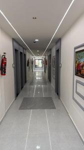 a hallway of a hospital with a hallwayngth at Hotel Runway in Vadodara +6 photos