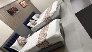 an overhead view of a bedroom with two bunk beds at Hotel Runway in Vadodara