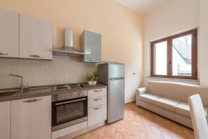 Η κουζίνα ή μικρή κουζίνα στο Residence Orso Bianco