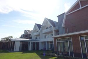 a rendering of the exterior of a building at Hotel The Dunes in Domburg +56 photos