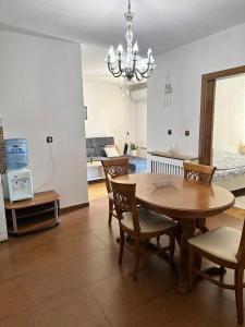 a kitchen and dining room with a table and chairs at Апартамент “Djanina 2” in Sandanski