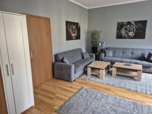 a living room with a couch and a table at Flensburg City 4 1 in Flensburg +2 photos
