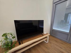 a large flat screen tv sitting on top of a table at Plaza España 2 in Alcazar de San Juan +10 photos