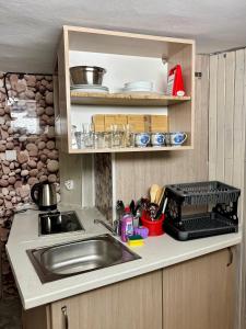 a kitchen with a sink and a counter top at hostel FARA in Nesebar