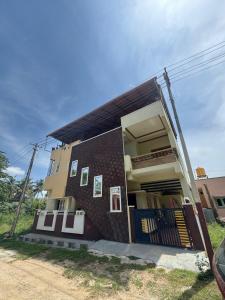 a building with art on the side of it at Janani service apartment in Kushālnagar +9 photos