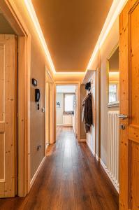 a hallway with wood flooring and a hallway with a hallway at Chalet Meridiana in Bormio