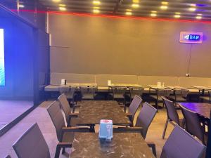 a dining room with tables and chairs and a sign at 7 Brothers Hotels in Marmaris +93 photos