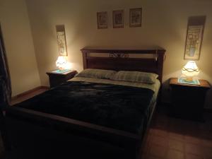 a bedroom with a large bed with two night stands at levIole in Belfiore