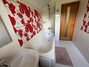 a bathroom with a toilet and a sink and a shower at БУДИНОК сімейних ПРИГОД in Vodniki +29 photos