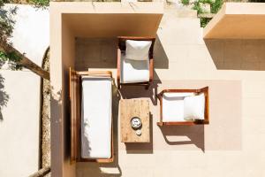 an aerial view of two chairs on the side of a building at PhώS Casa Lachania in Lachania