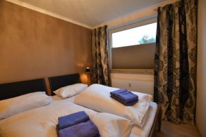 Llit o llits en una habitació de Wohnung Holly, 44B