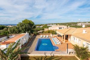an aerial view of a villa with a swimming pool at Villa Dori by Villa Select in Punta Prima