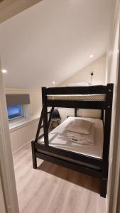 a bedroom with two bunk beds in a room at Brudevoll Gard in Ørsta