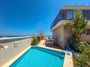 a swimming pool on the side of a house at Sky Garden - luxury suite in Monopoli +17 photos
