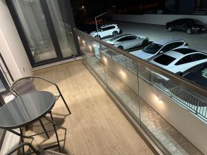 a balcony with cars parked in a parking lot at Apartament Meraki Resort&Spa in Năvodari