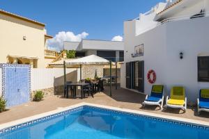 a villa with a swimming pool and a house at Villa Miramar Gale by Villa Select in Galé