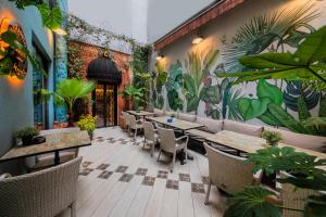 a restaurant with tables and chairs and a mural on the wall at Ayramin Deluxe Hotel - Anex in Istanbul
