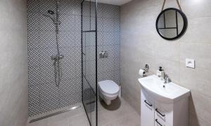 a bathroom with a shower and a toilet and a sink at Tarasova in Zbudský Rokytov +9 photos