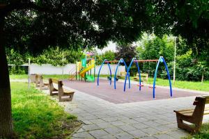 a park with a playground with benches in it at Marina Sarafovo by Cosher in Burgas