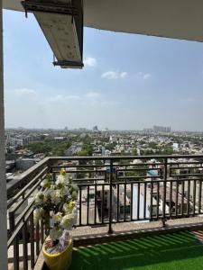 a balcony with a view of a city at the Aurelia estate studio apartment Alpha 2 in Greater Noida