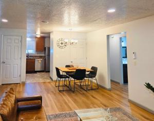 a living room and dining room with a table and chairs at Siesta Sunset in Boise