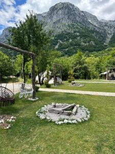 a garden with a fire pit in the grass at The Overlook in Bogë