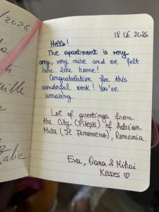 a notebook with handwriting on the pages at Suite La Corte in Florence