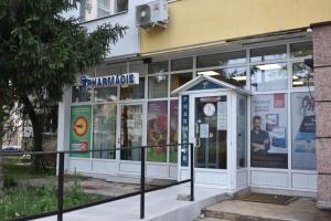 a store front of a building with glass doors at Апартамент за гости Лале in Lovech