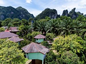 an aerial view of a resort with mountains in the background at Khao Sok Jungle Huts Resort in Khao Sok National Park