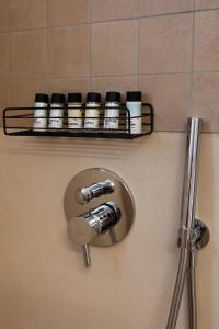 a bunch of bottles on a bathroom door at PhώS Casa Lachania in Lachania +80 photos